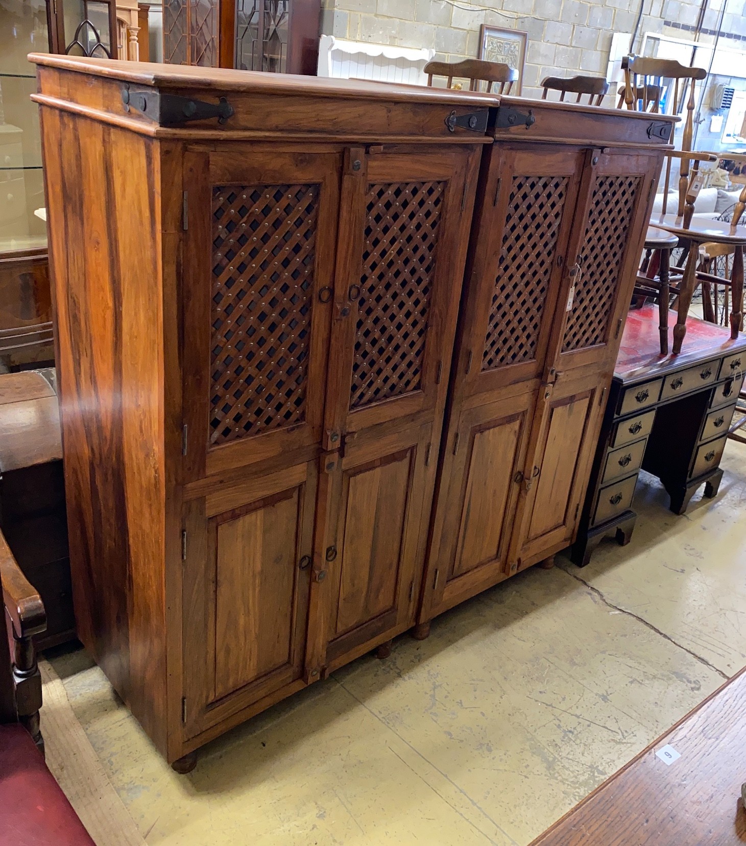 A pair of Indonesian metal mounted hardwood wardrobes, width 85cm, depth 55cm, height 161cm